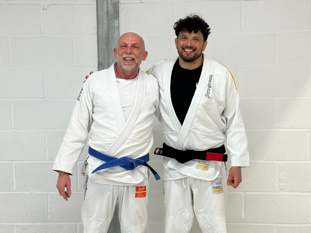 Richard stands with his Ju-Jitsu coach