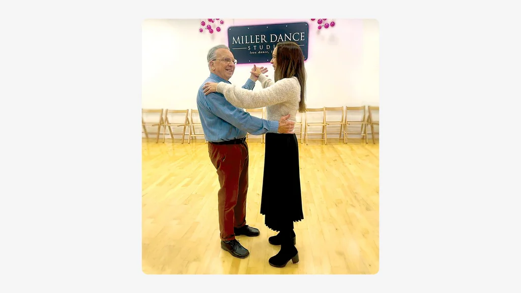 An older man and younger woman dance together in a studio. Credit: Samantha Ashford.