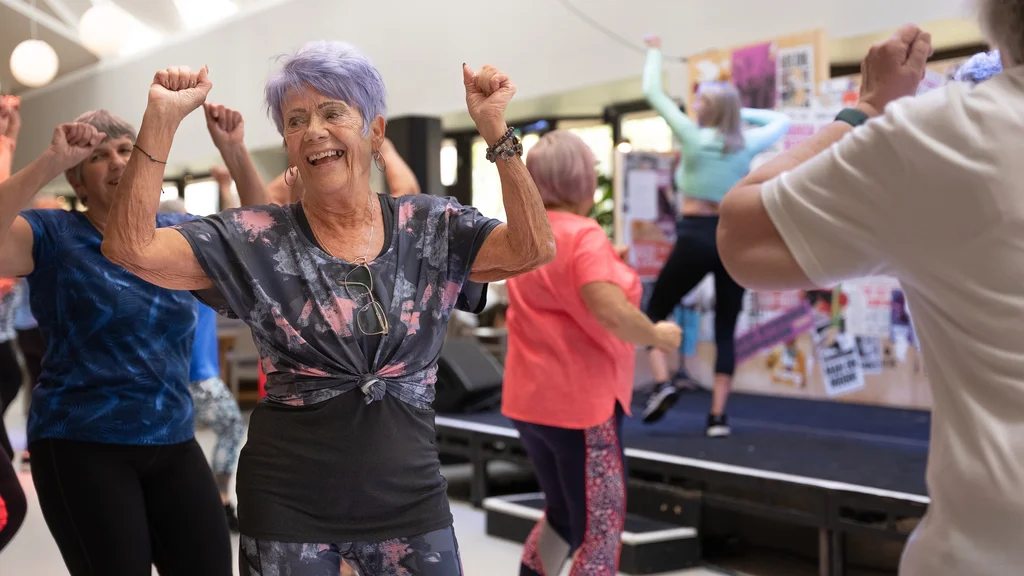 A woman dancing in an exercise class