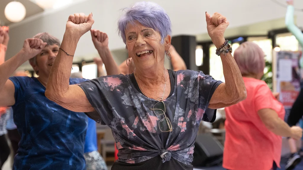 A woman dancing in an exercise class